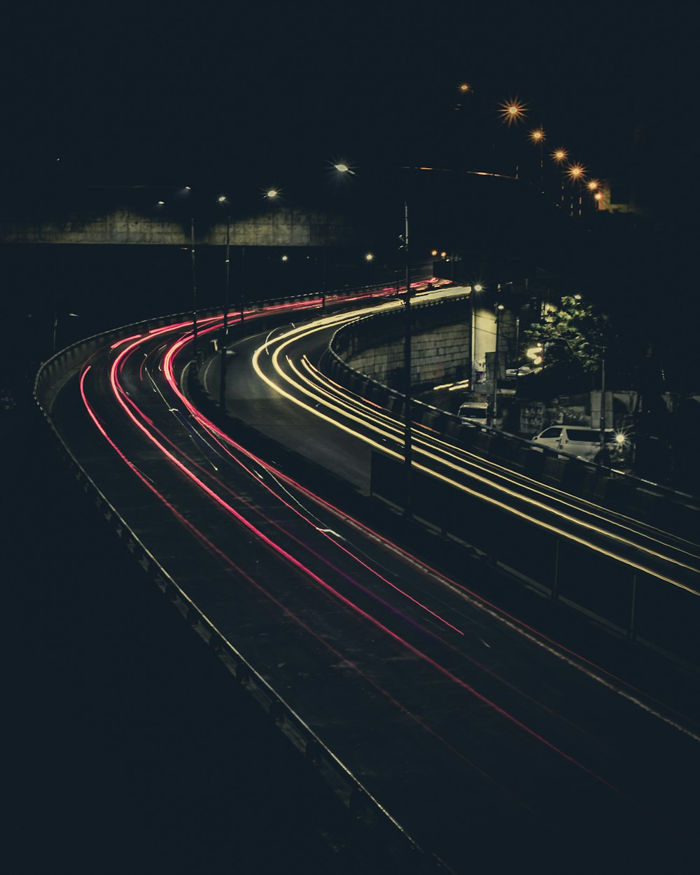 time lapse photo of road at night