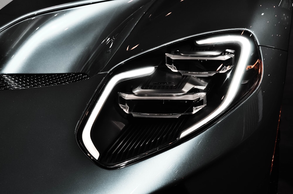 a close up of the front end of a sports car