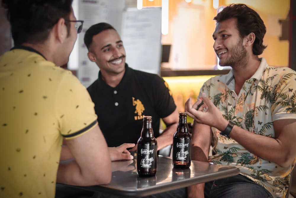 three men drinking beer