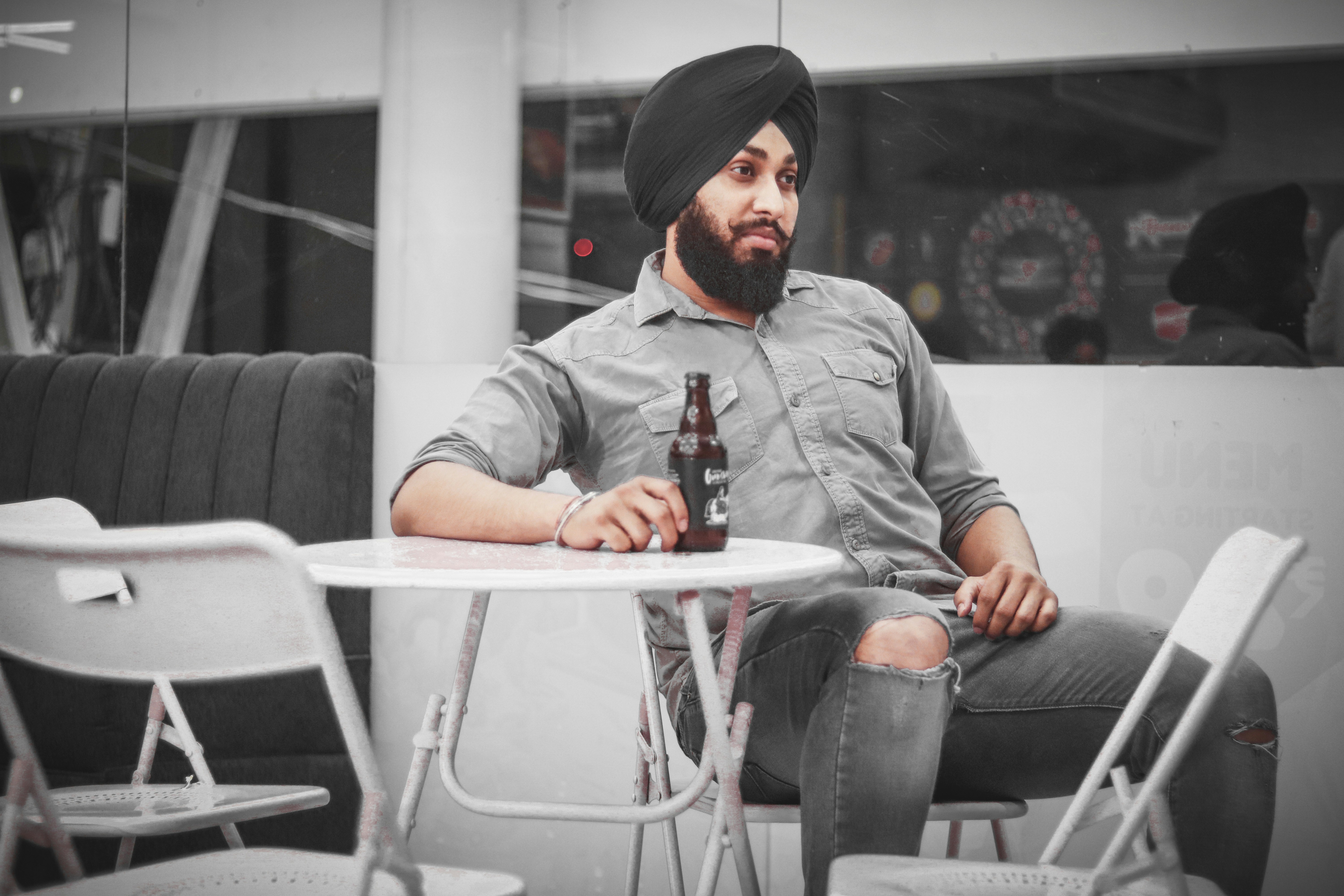 man sitting on chair outside