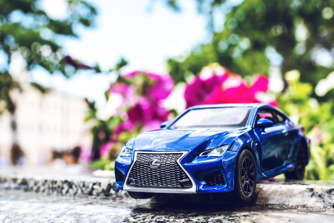 blue Lexus coupe on road