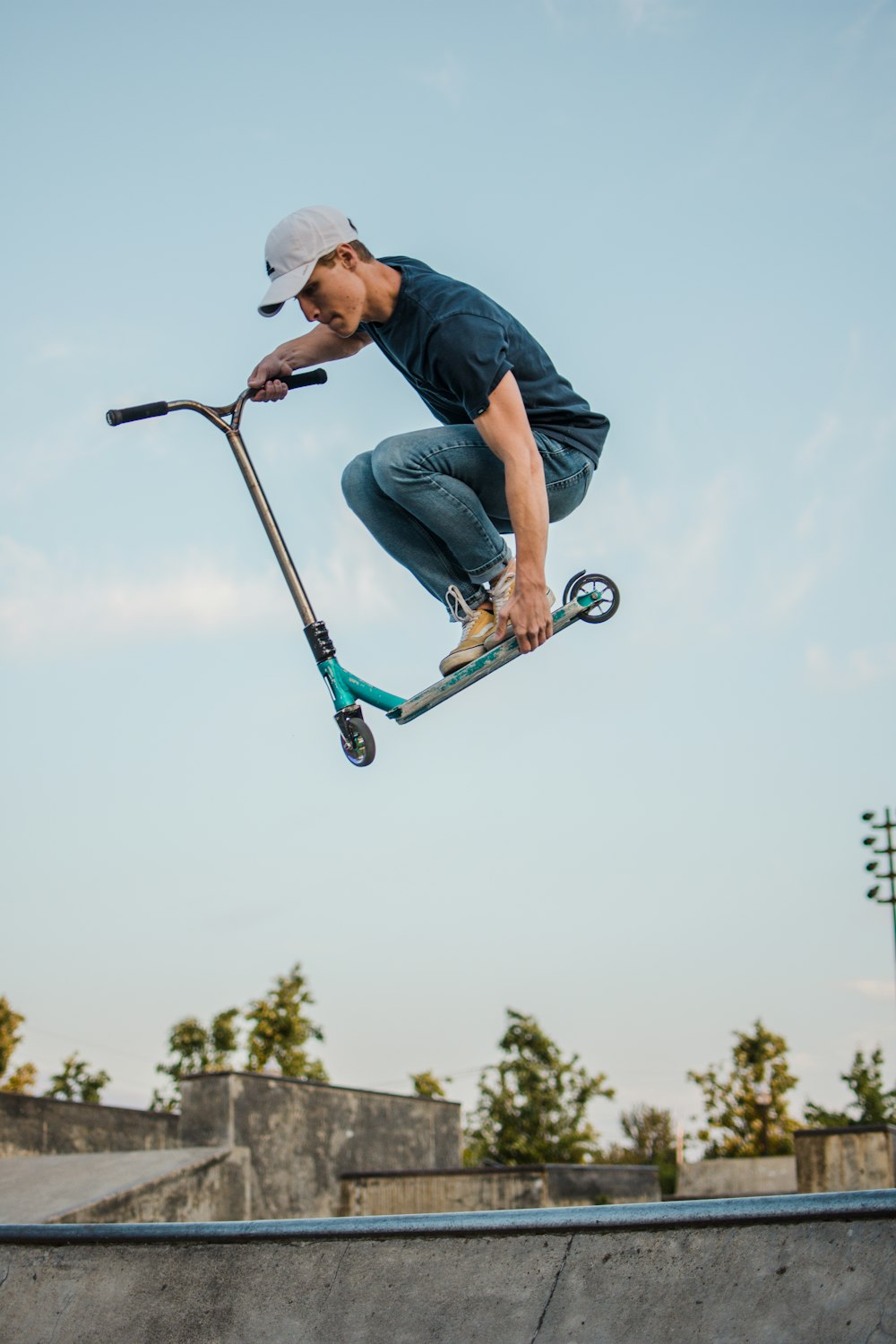 man flipping kick scooter