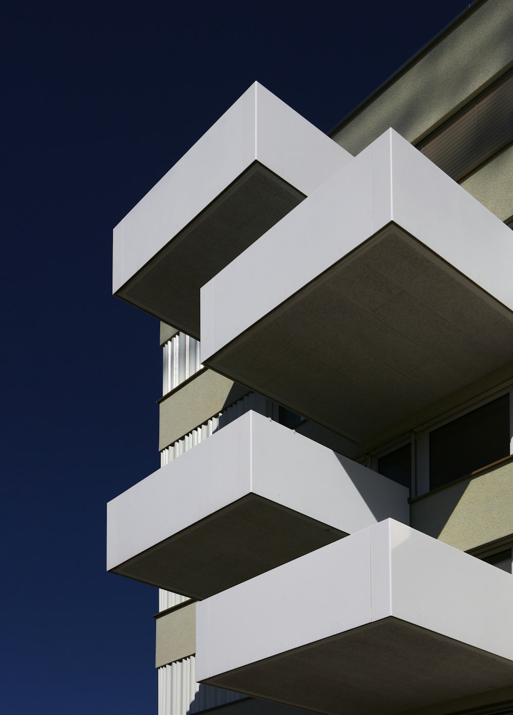 a tall building with balconies and balconies on it