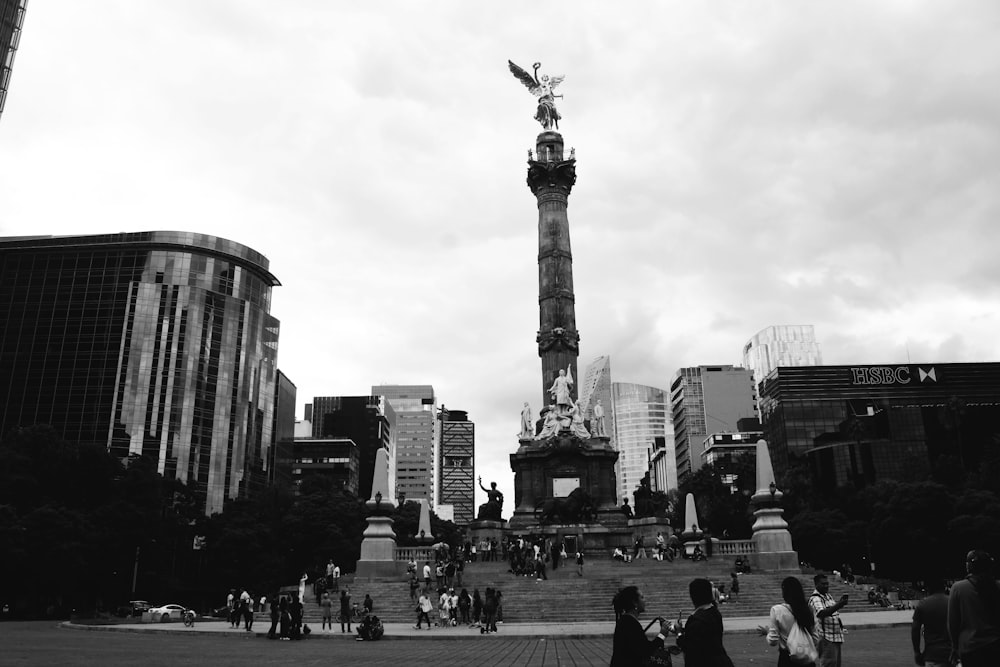 people standing near statue