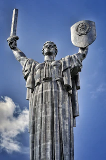 Artistic rendering of the King of Swords surrounded by swirling clouds and sharp lines symbolizing clarity