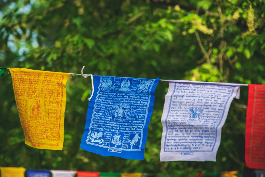 three yellow, blue, and white hanging decors