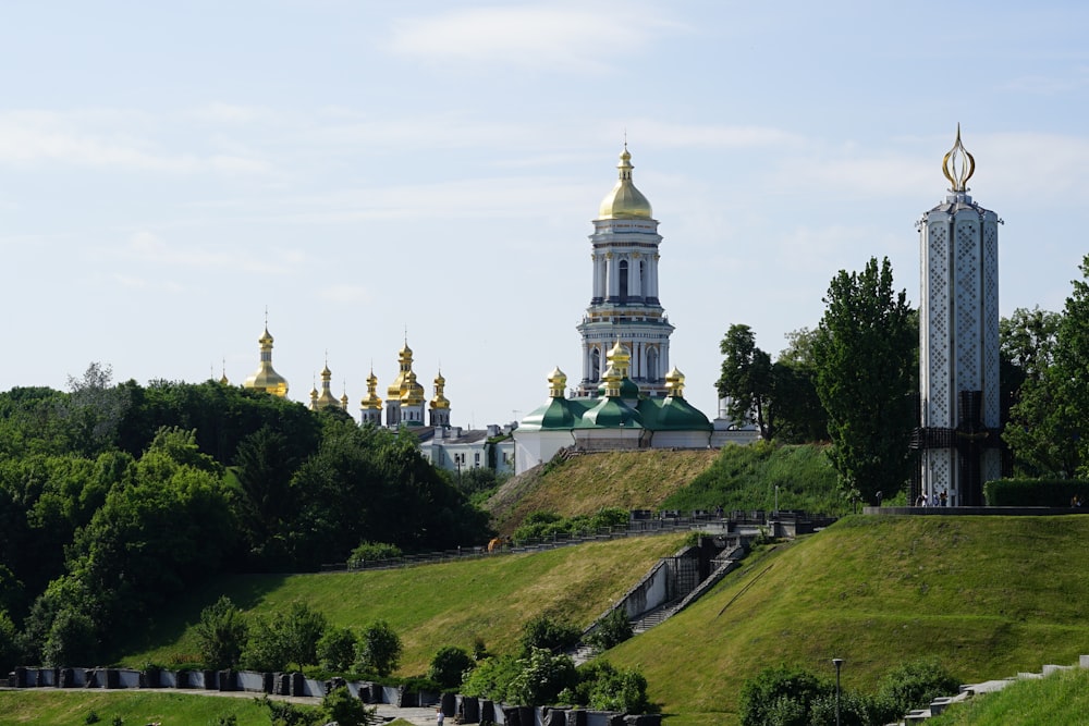 landscape photo of a white, green and gold temple