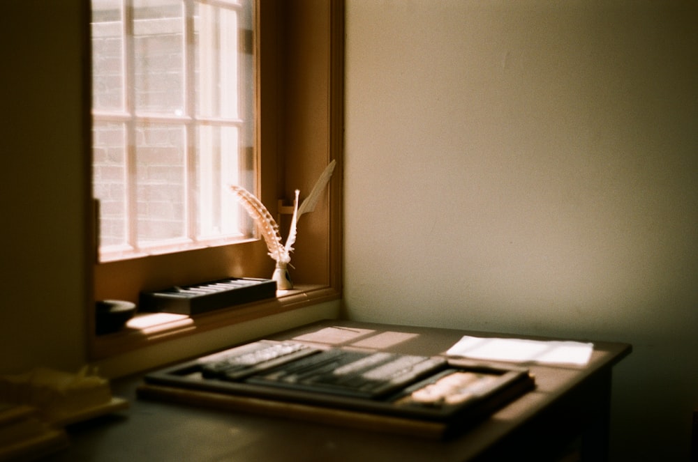 brown wooden desk with writing tools