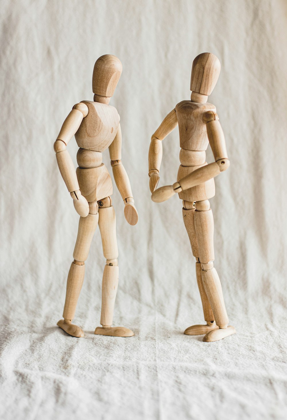 two wooden dolls