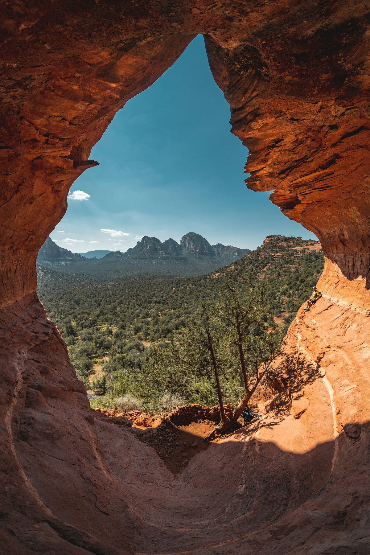 A sunlit desert cave in warm earth tones, the obscure work of becoming before the world ever sees it