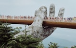 people walking on bridge during daytime