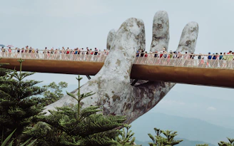 people walking on bridge during daytime