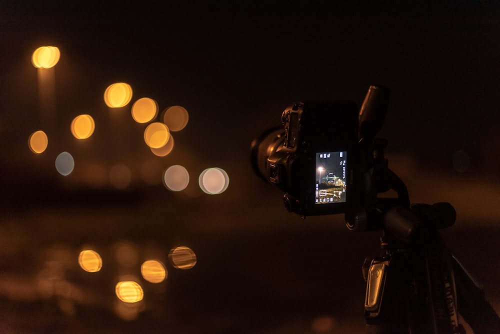 black DSLR camera with bokeh lights