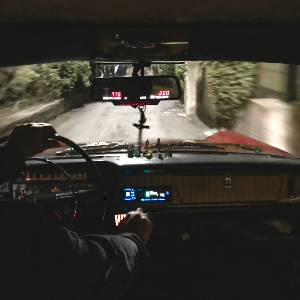 man driving classic car