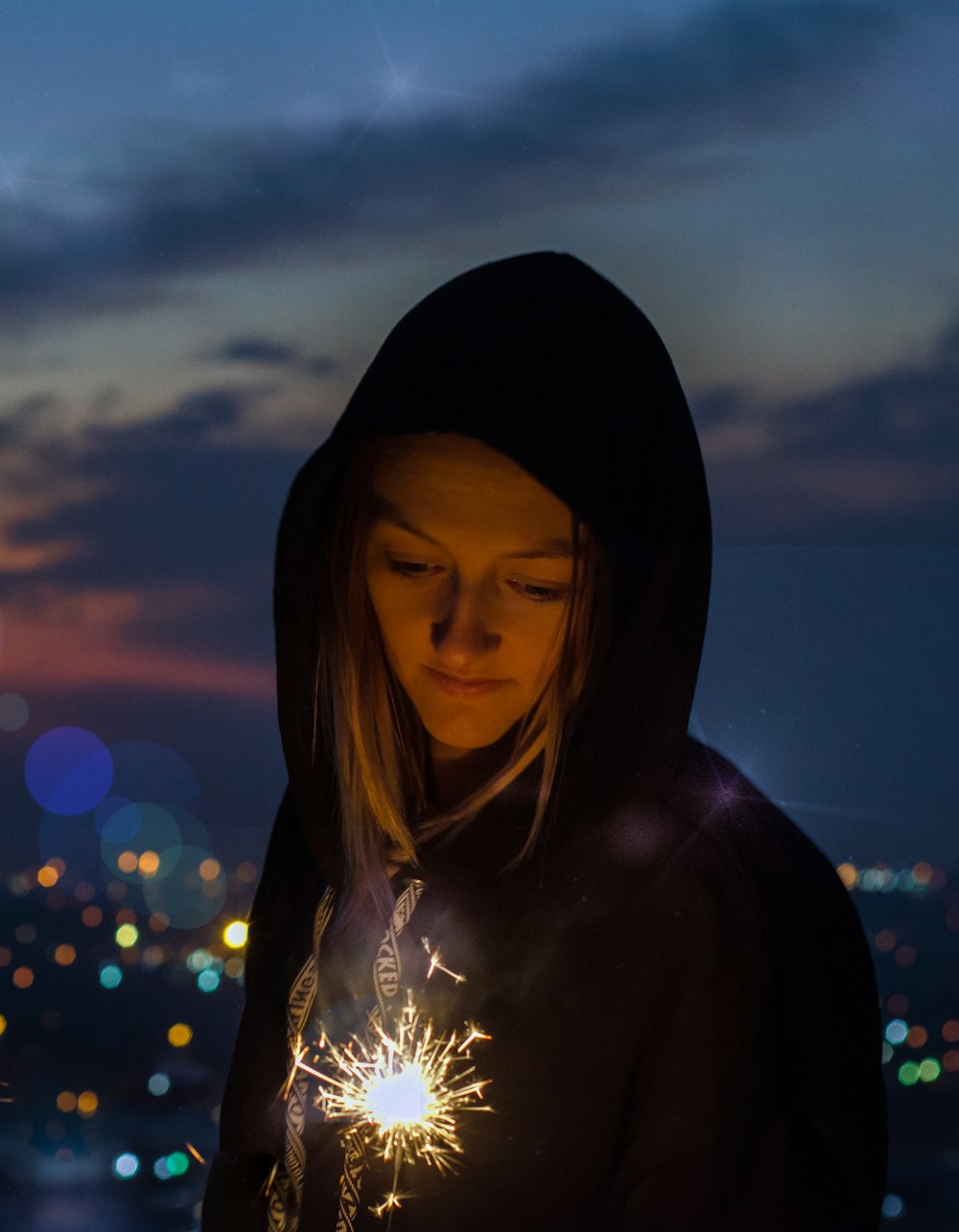 portrait of woman holding fireworks