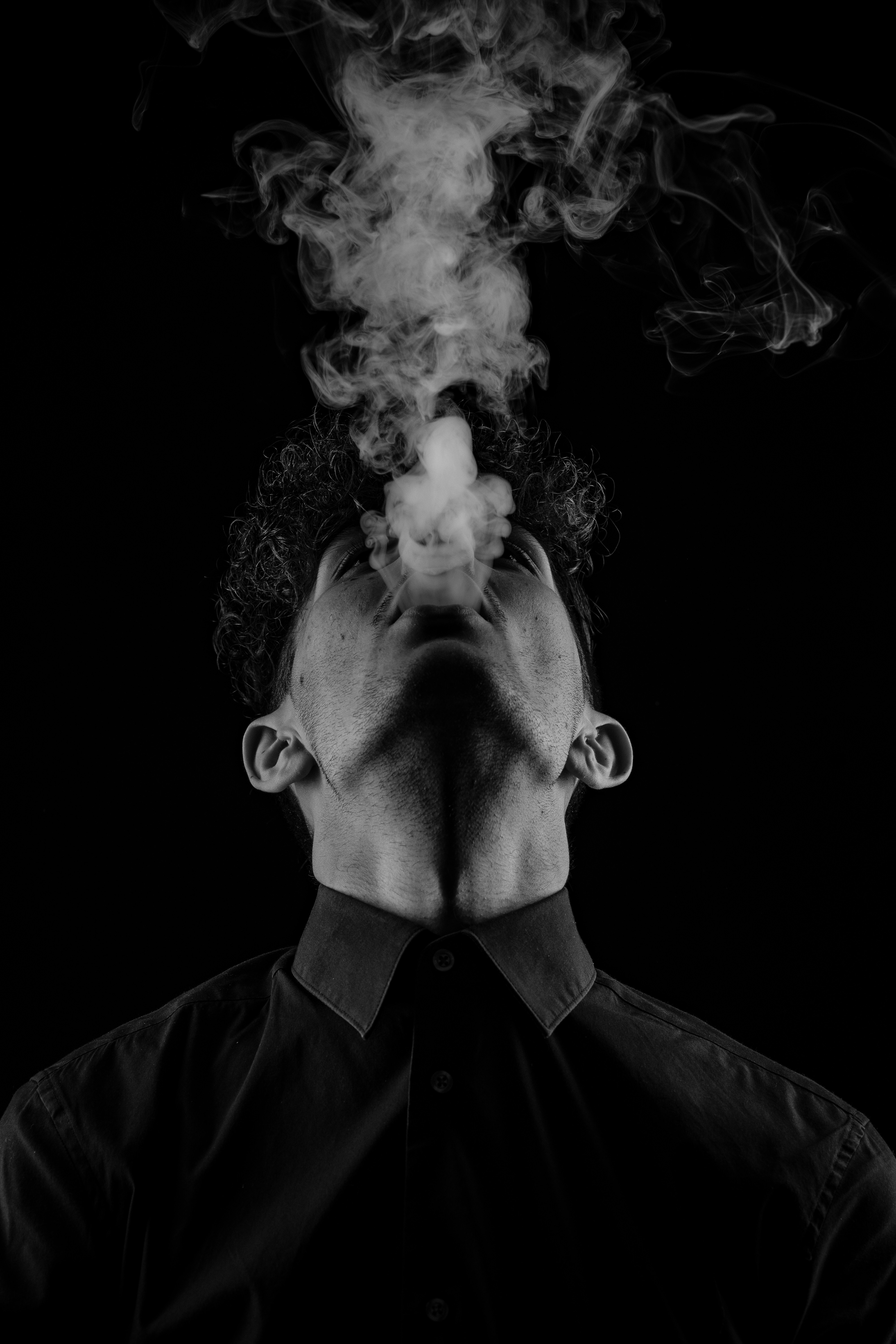 Black and white photo of a men smoking