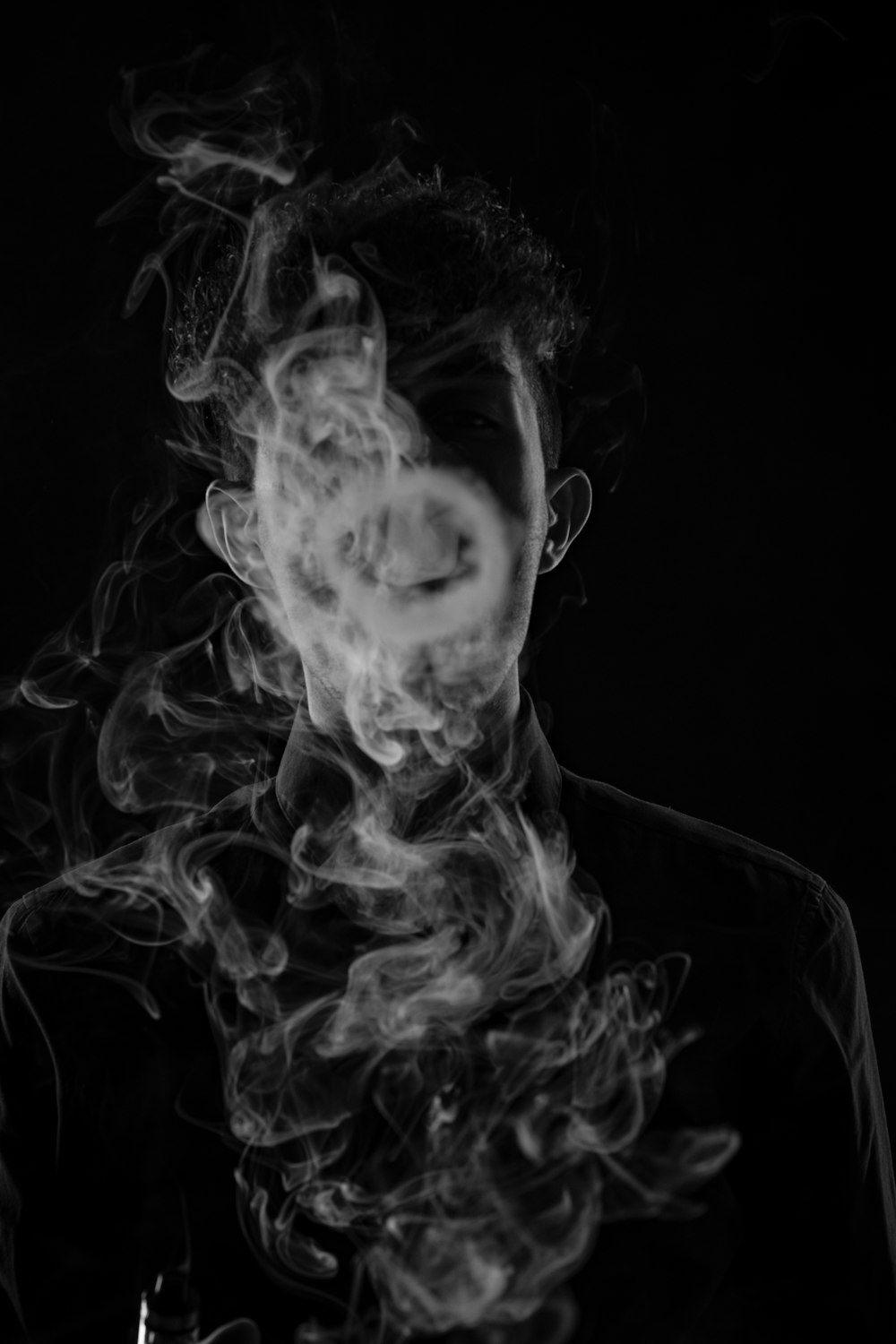 man making smoke art
