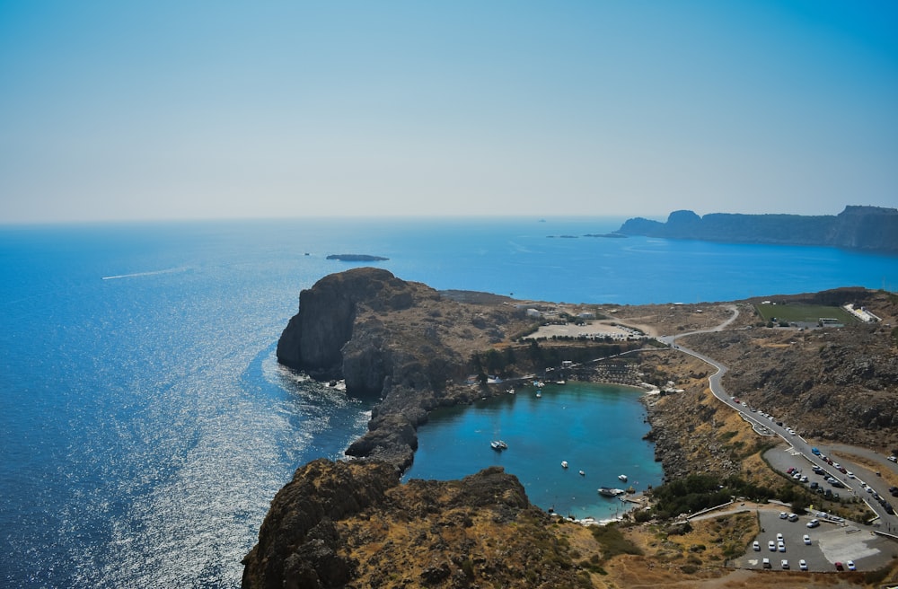 bird's eye view of a cliff and lake