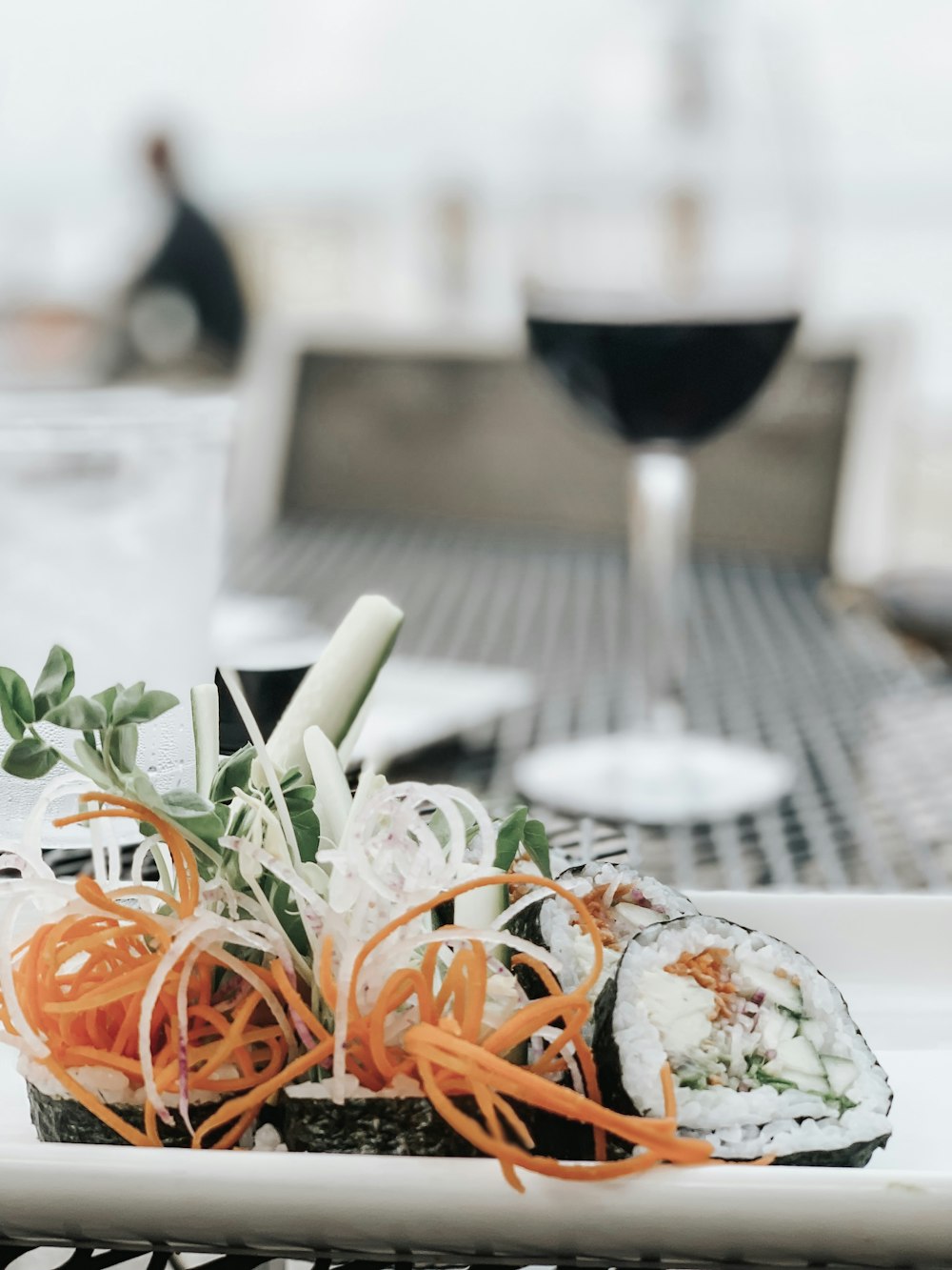 sushi with garnish on white plate