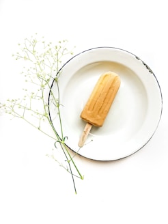 ice cream pop on white plate