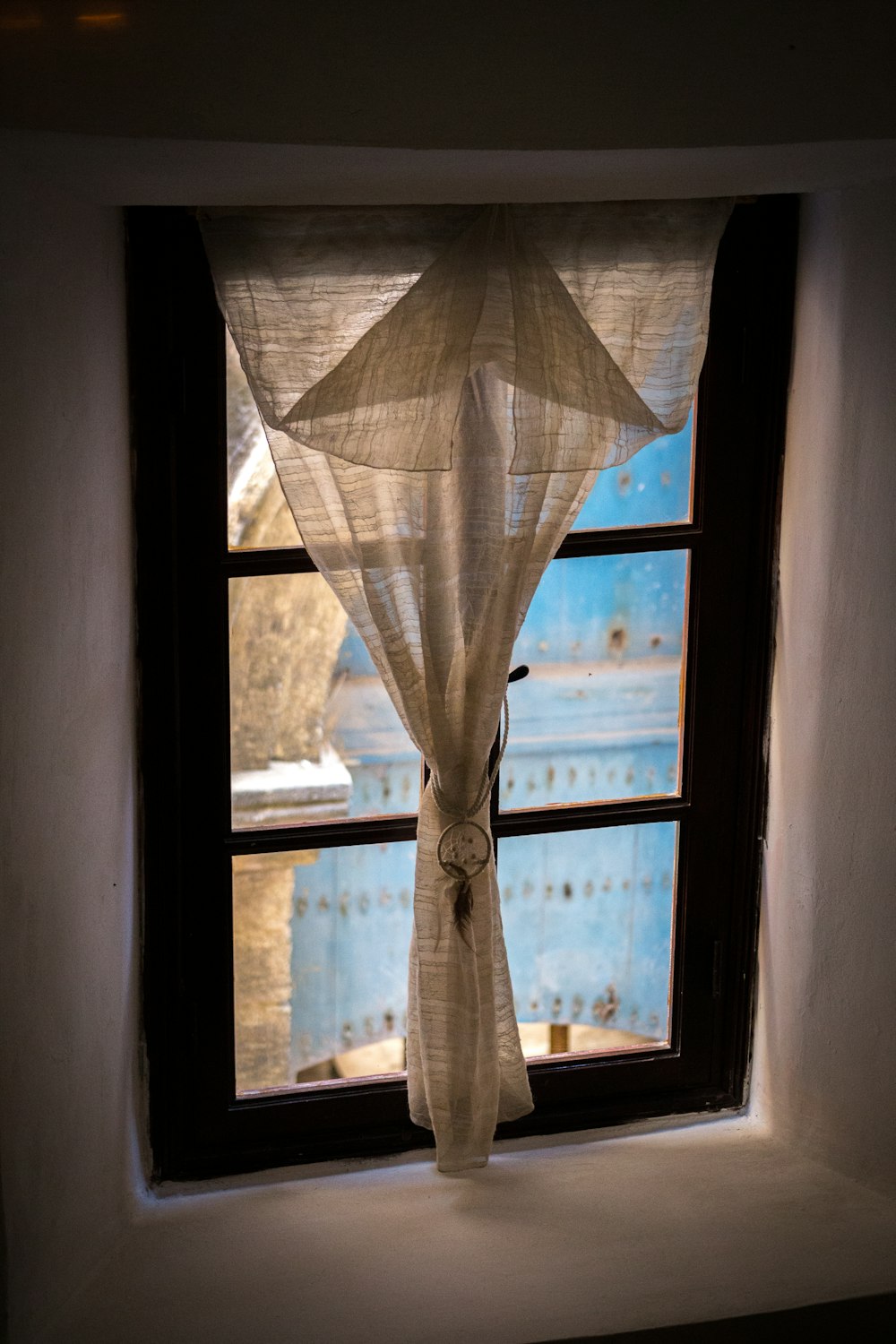 white curtain on brown window