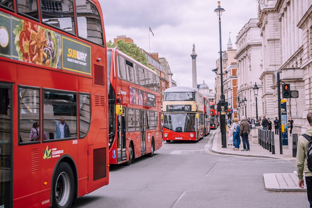 several double-decker buses on road