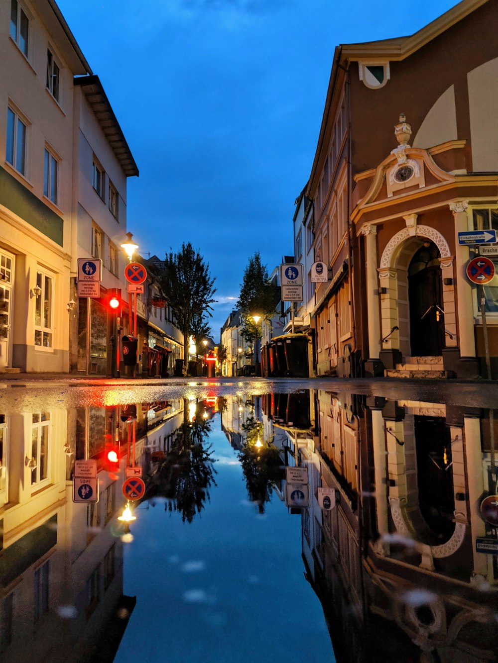 canal between buildings during daytime