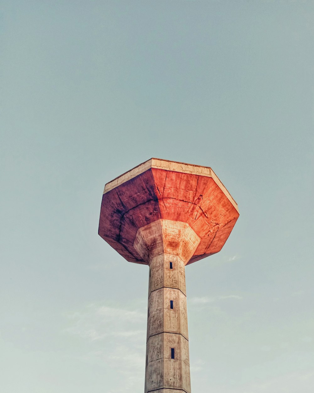 low angle photography of grey concrete tower