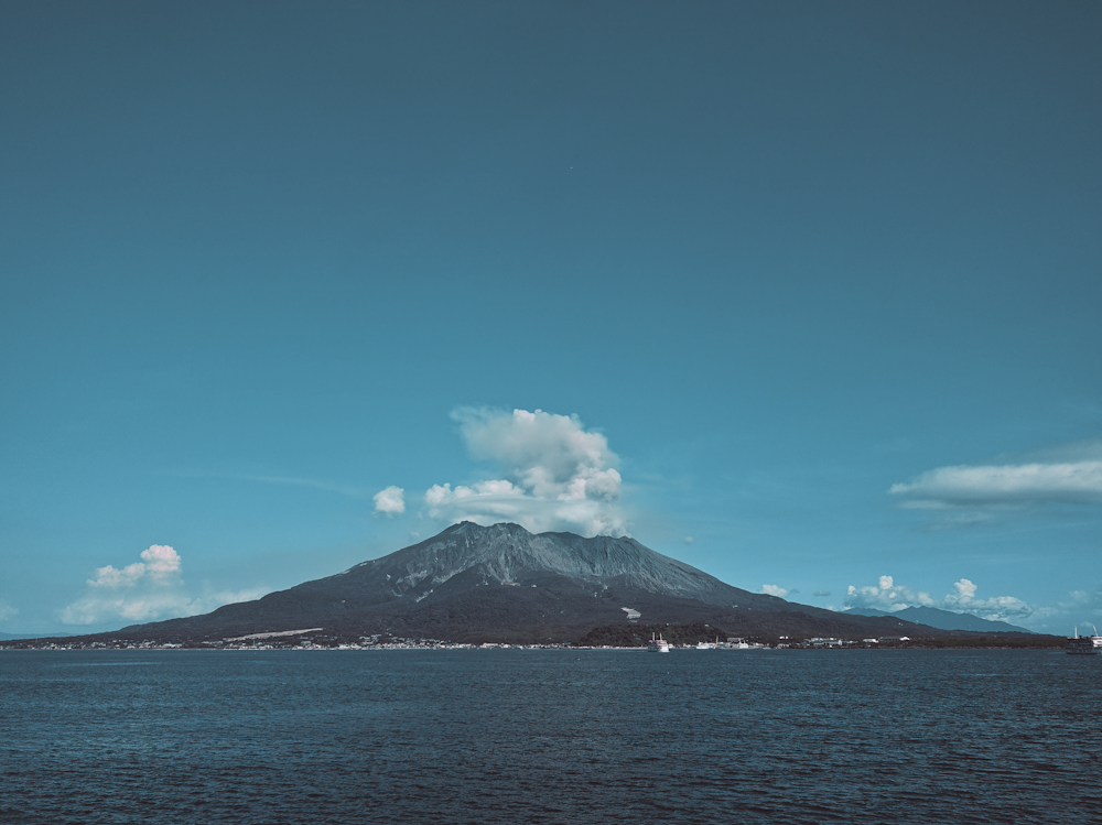 landscape photo of white and brown volcano