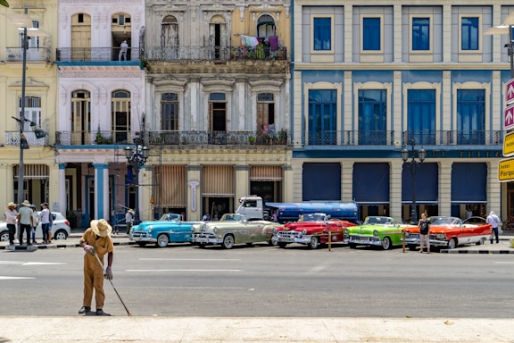 five assorted-colored cars photo
