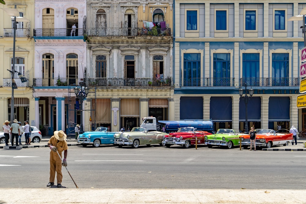 five assorted-colored cars photo