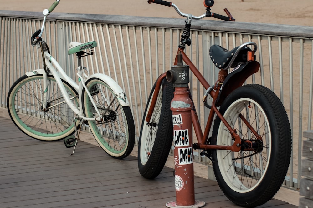 two red and white fat bike and beach cruiser bikes