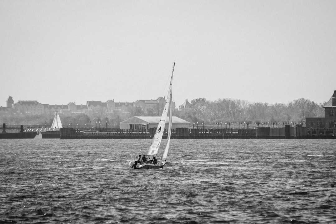 white sail boat grayscale photo