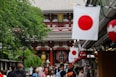 people standing beside building