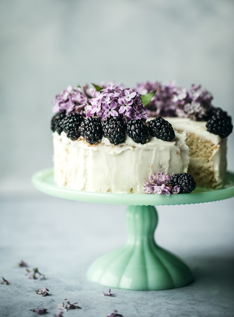 Chocolate drip birthday cake with floral decorations