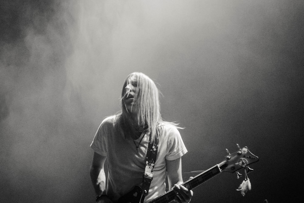 man playing electric guitar