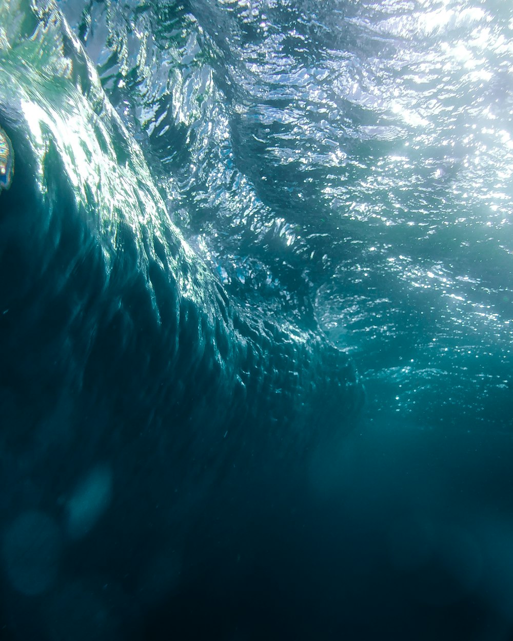 a large body of water that is under a wave