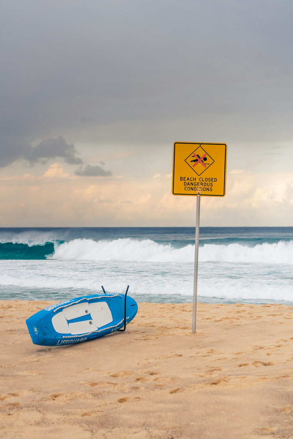 white and black wake board near yellow signage