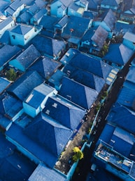 aerial photography of blue-roofed houses during daytime