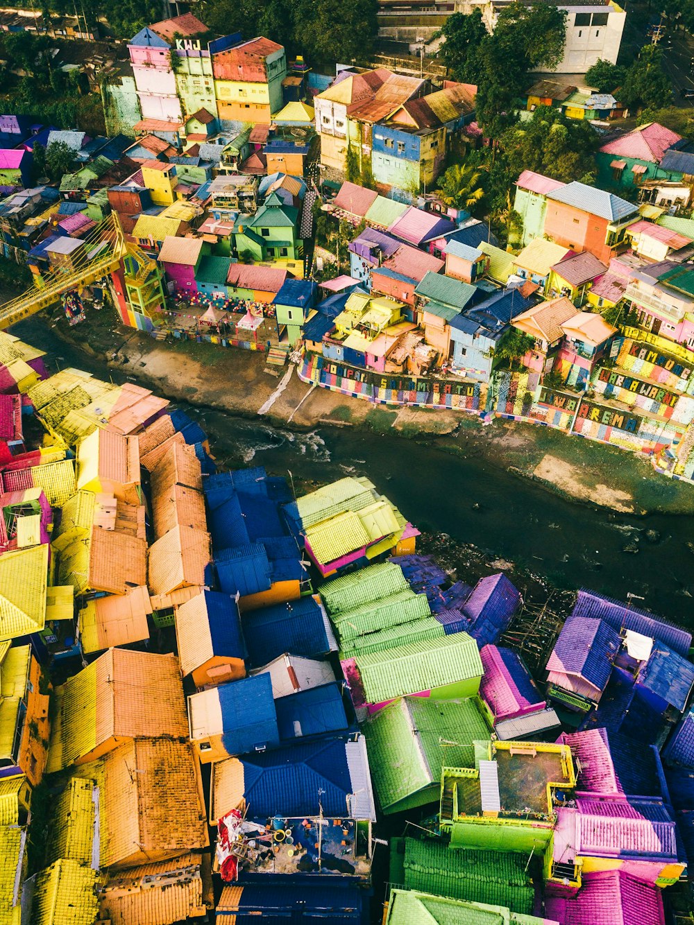 aerial photo of multicolored houses beside river