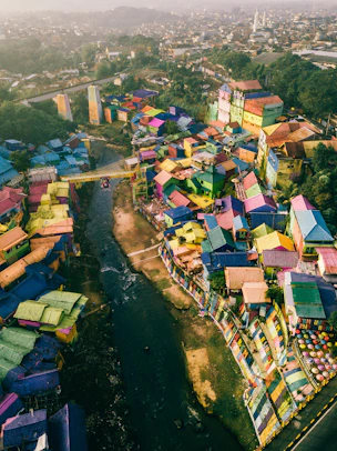 high angle photography of rainbow painted roofed houses