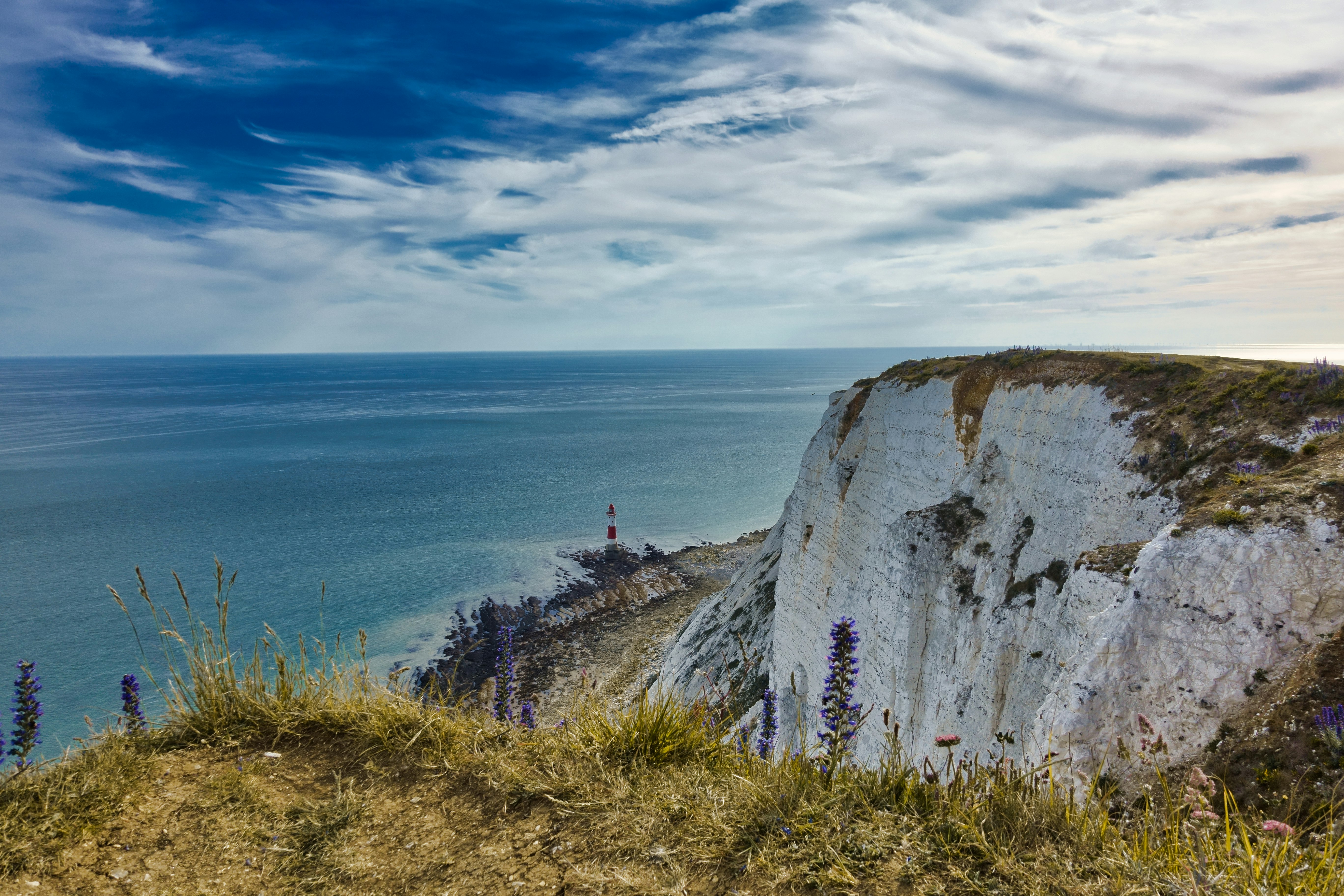 cliff by the body of water