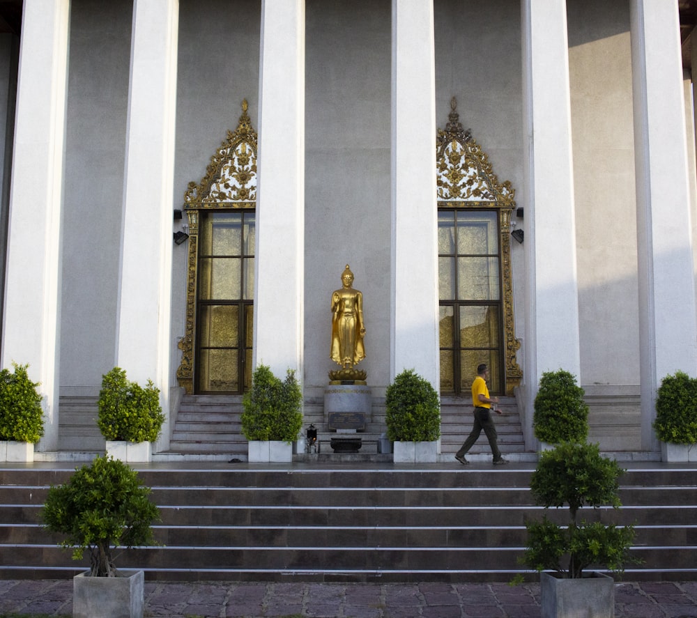 person walking on stairs outside building