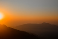A beautiful sunrise over the rolling hills of Chikmagalur.