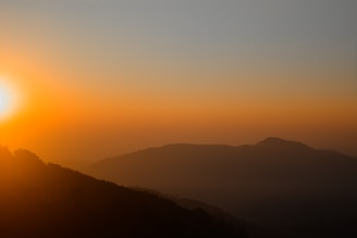 A beautiful sunrise over the rolling hills of Chikmagalur.