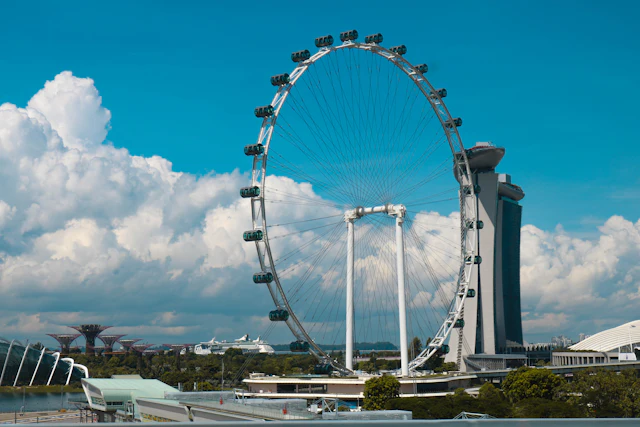 The Singapore Flyer wheel under blue sky and cloud
