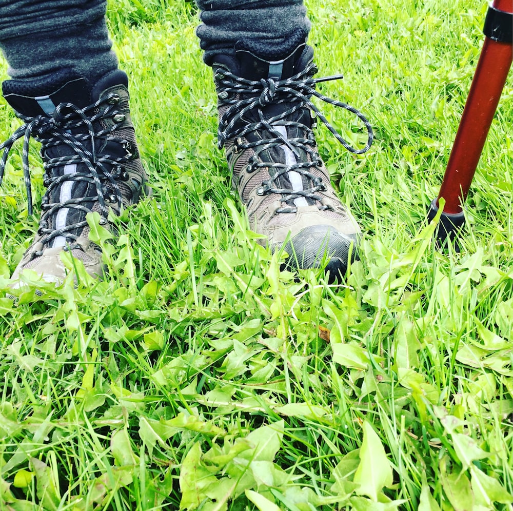 pair of brown-and-black hiking boots