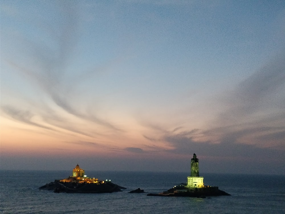 lighted lighthouse during golden hour