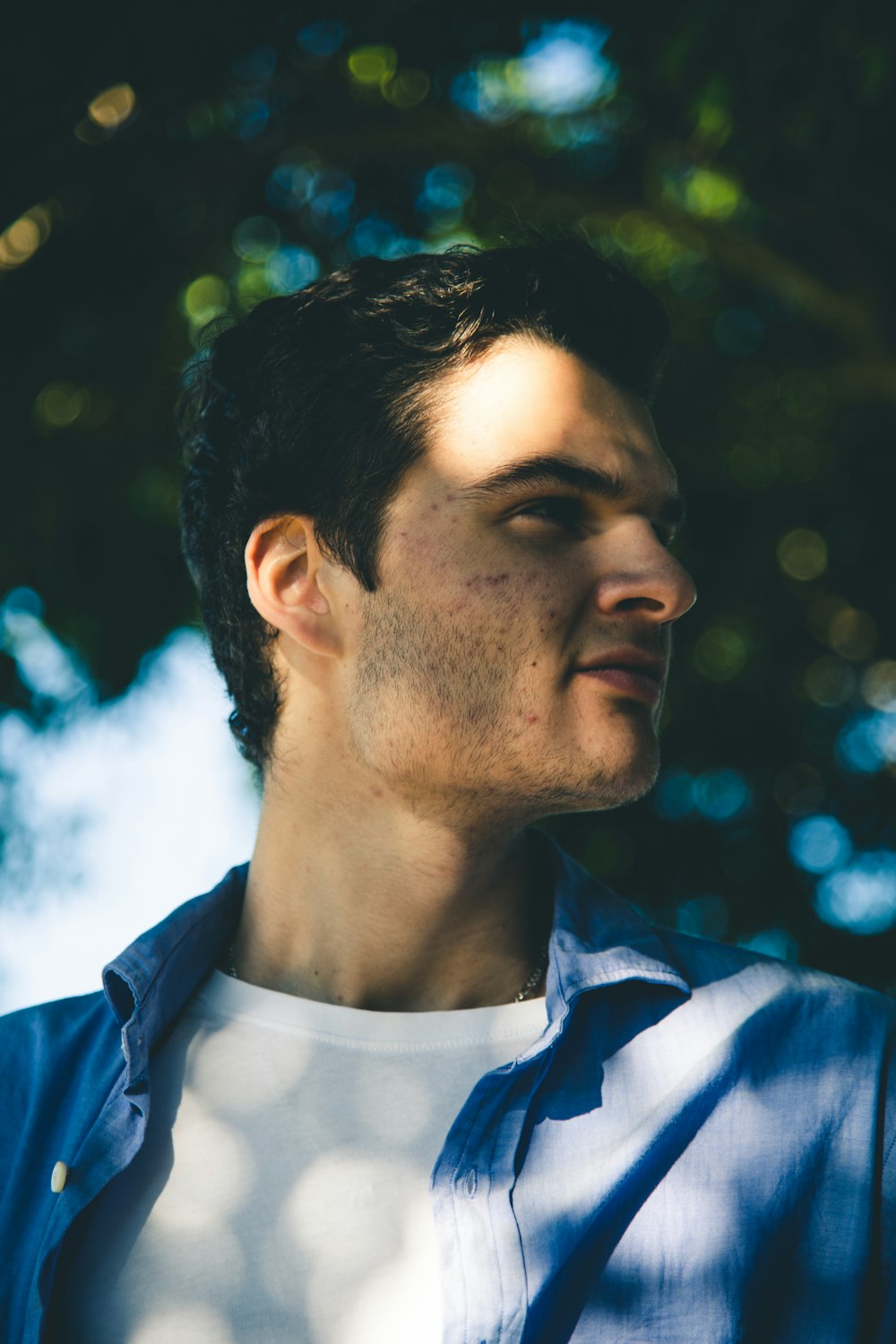 man wearing blue dress shirt