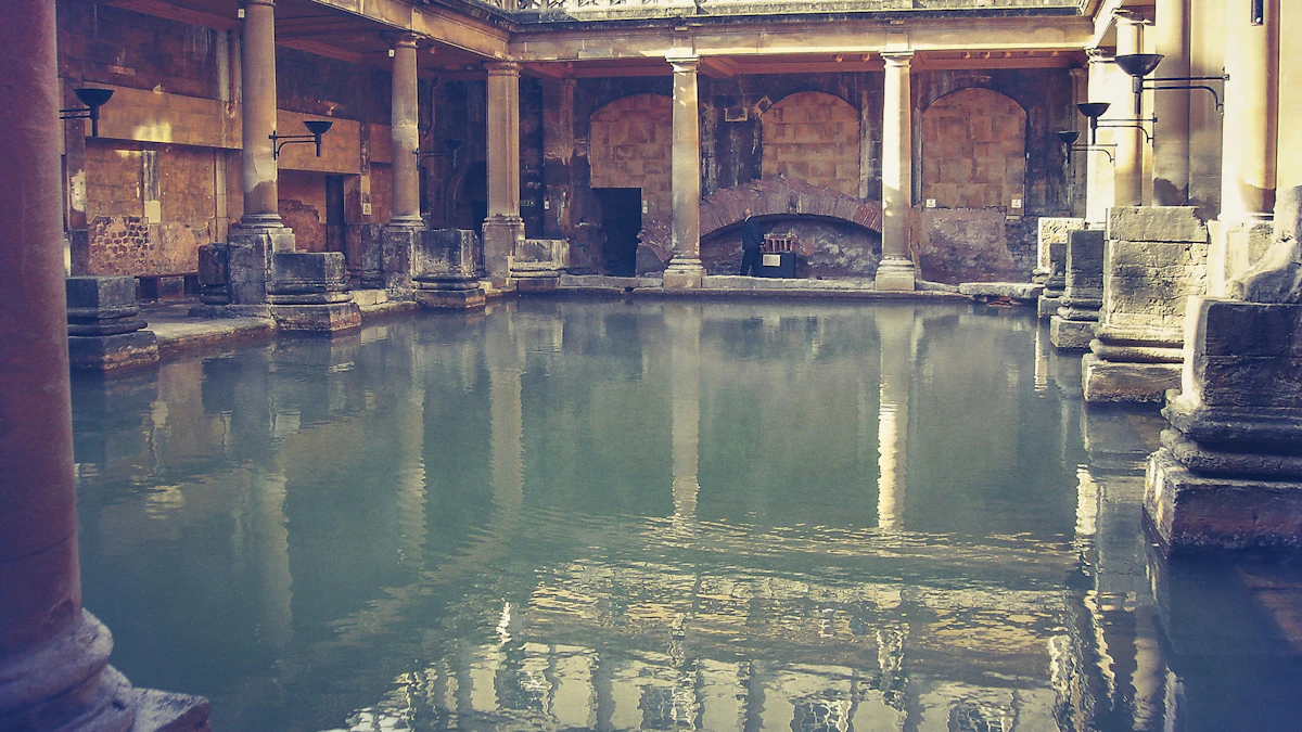 Columned indoor thermal bathing pool with steam on the water